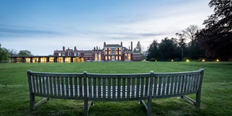 Image of Hinxton Hall and lawns at dusk