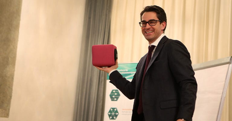 Conference speaker holding a catchbox