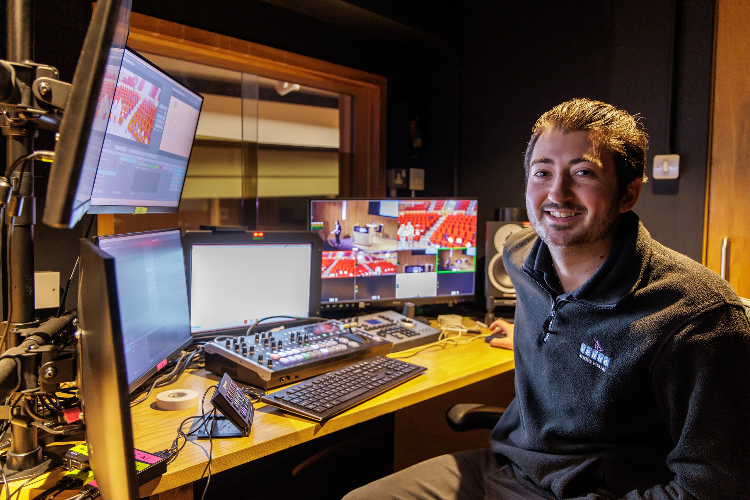 Technician, Luke, in the AV booth.