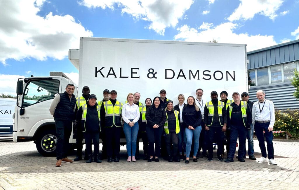 The Kale & Damson team standing in front of a K&D lorry. 